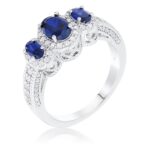 Prosebud™ Blue Muse – 3-Stone Sapphire Oval Halo Ring